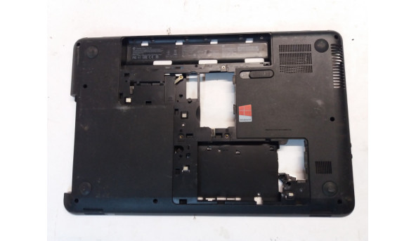 Нижня частина корпуса для ноутбука HP Compaq Presario CQ58, 15.6", 704016-001, Б/В, пошкоджено одне кріплення (фото)